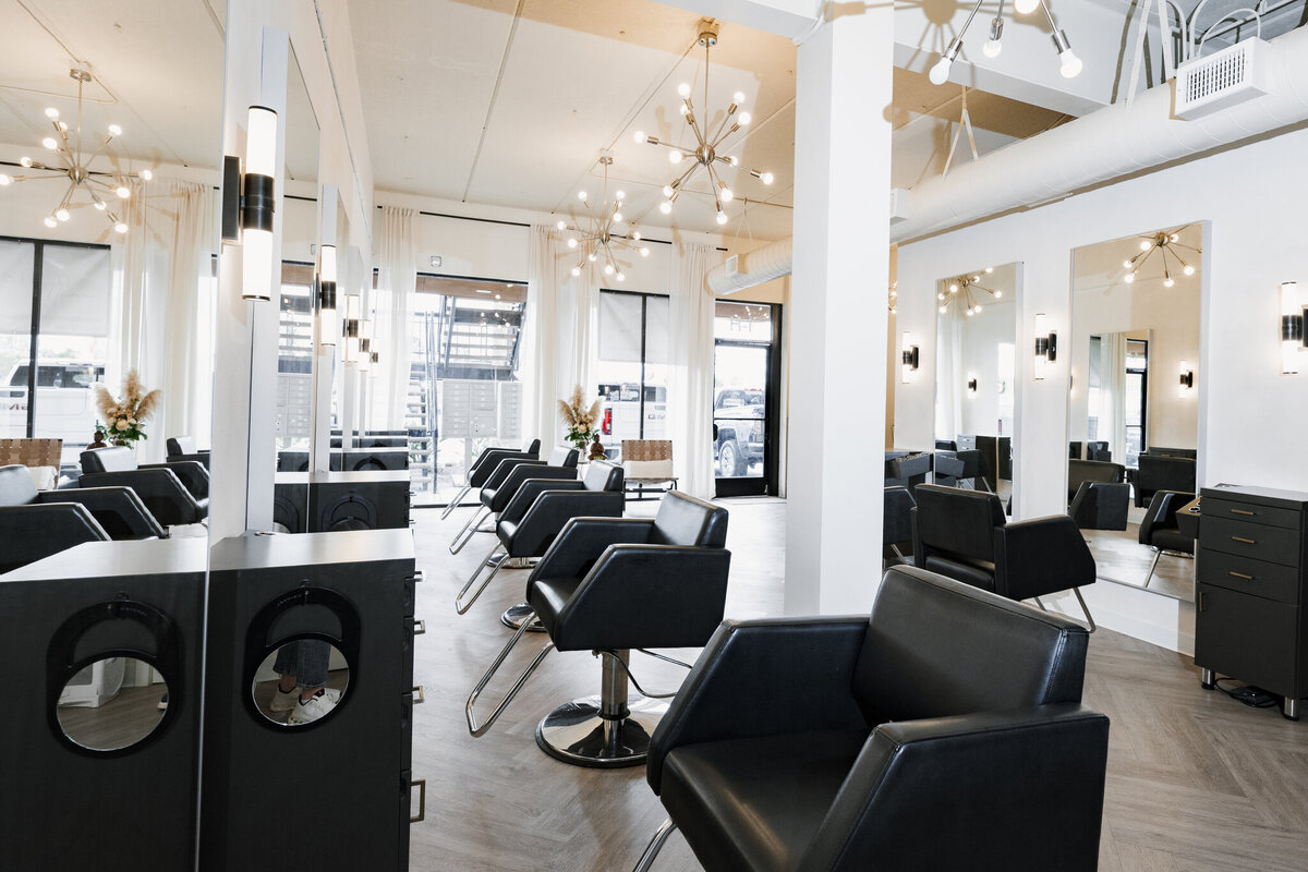 upscale hair salon with black white and gold decor