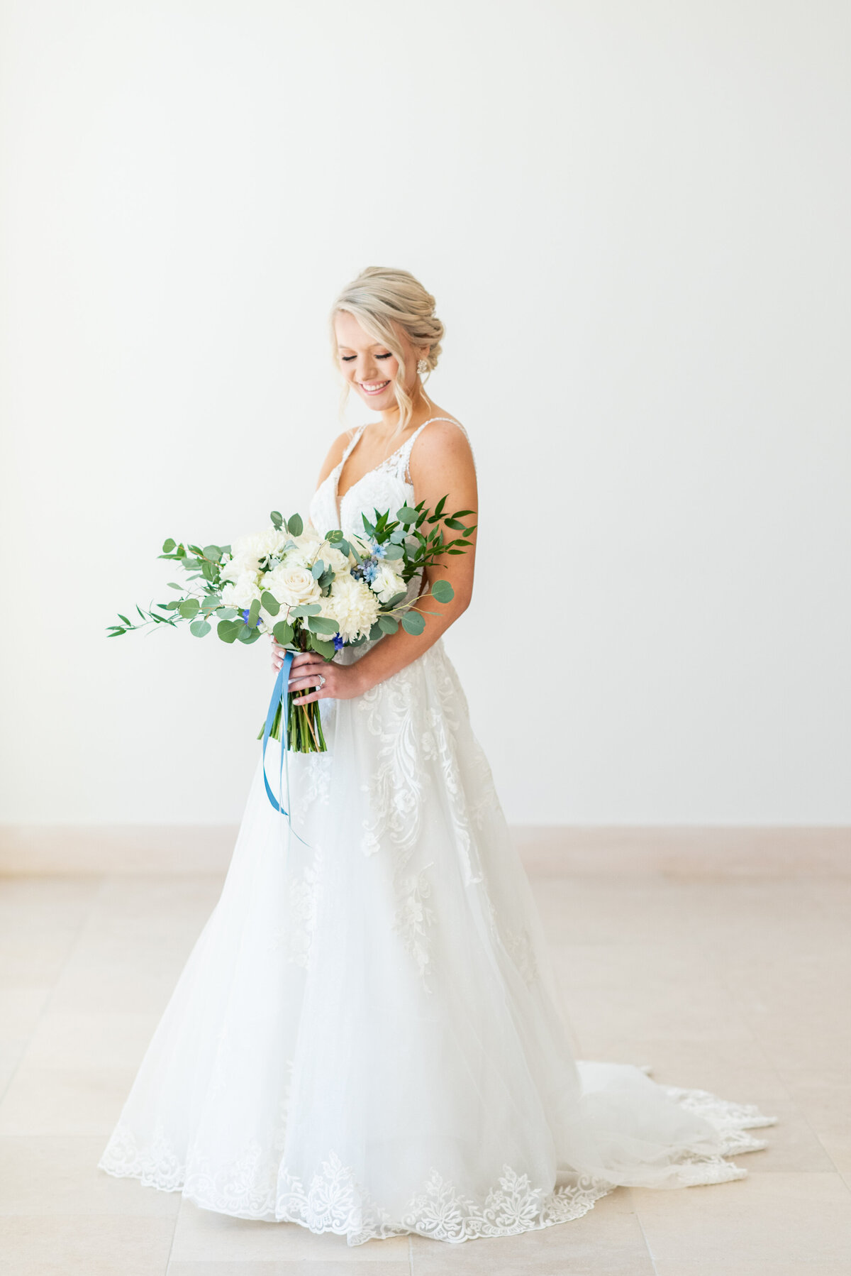 bride posing with flowers