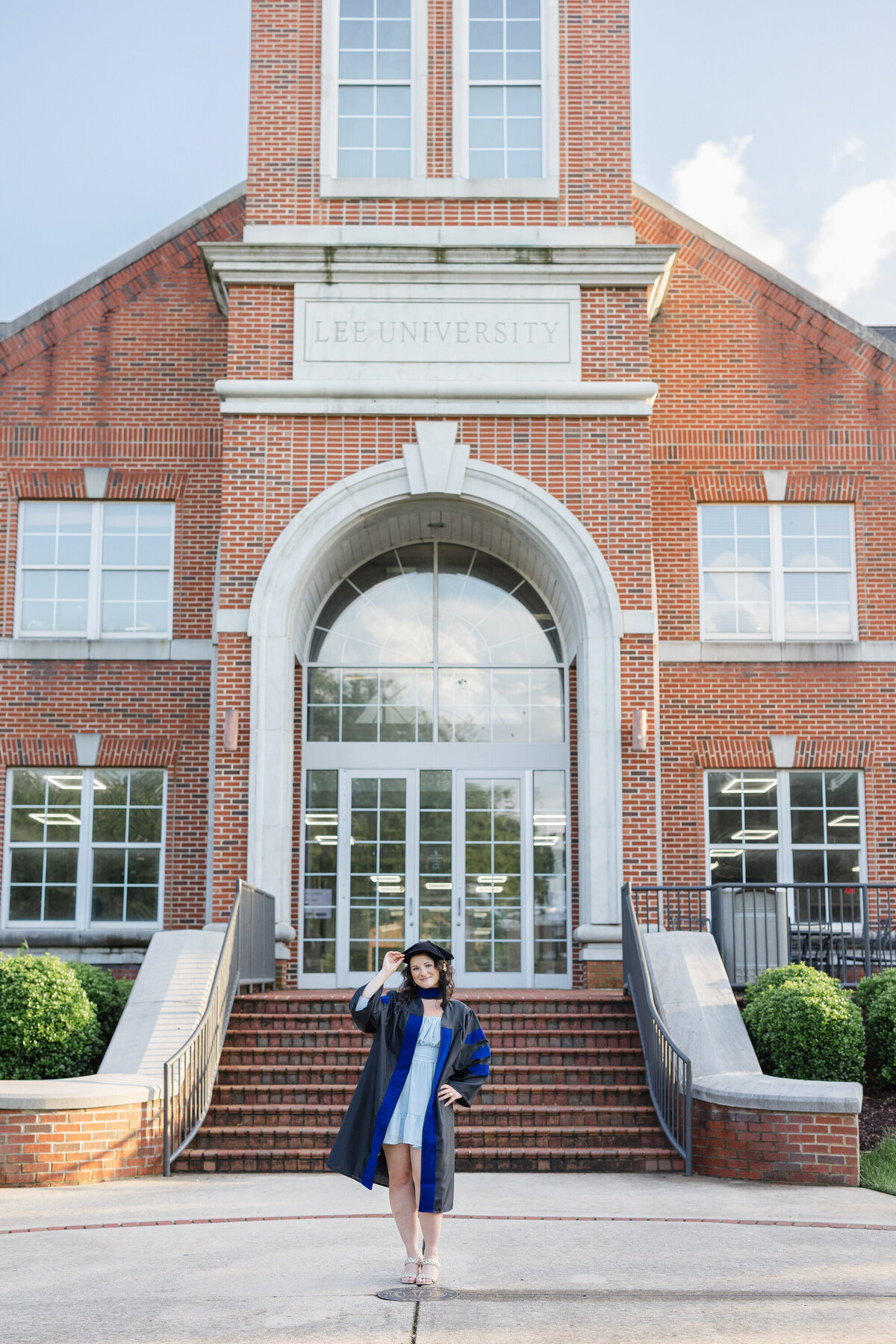 PhD college graduate posing at Lee University in Cleveland, TN