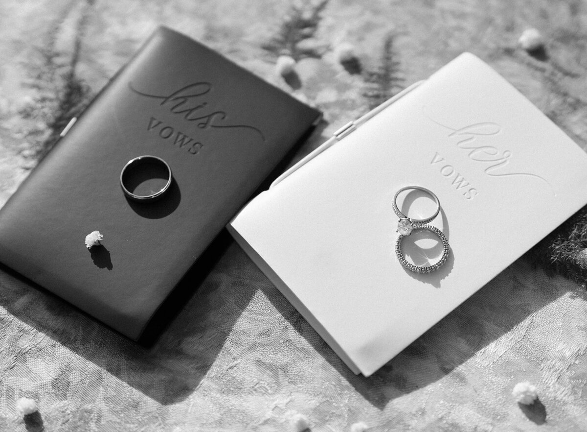 His and her vow books with rings on top