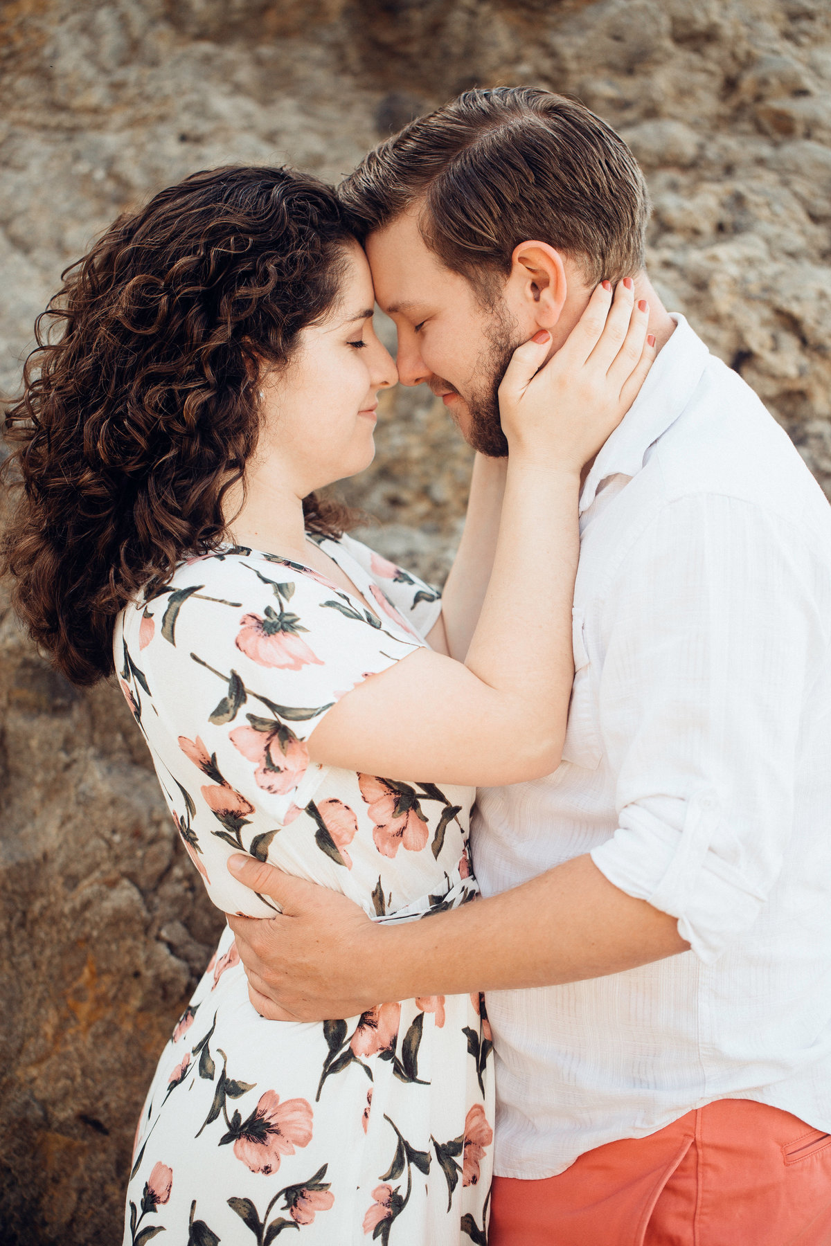 Engagement Photograph Of  Woman Holding a Man On His Face Los Angeles