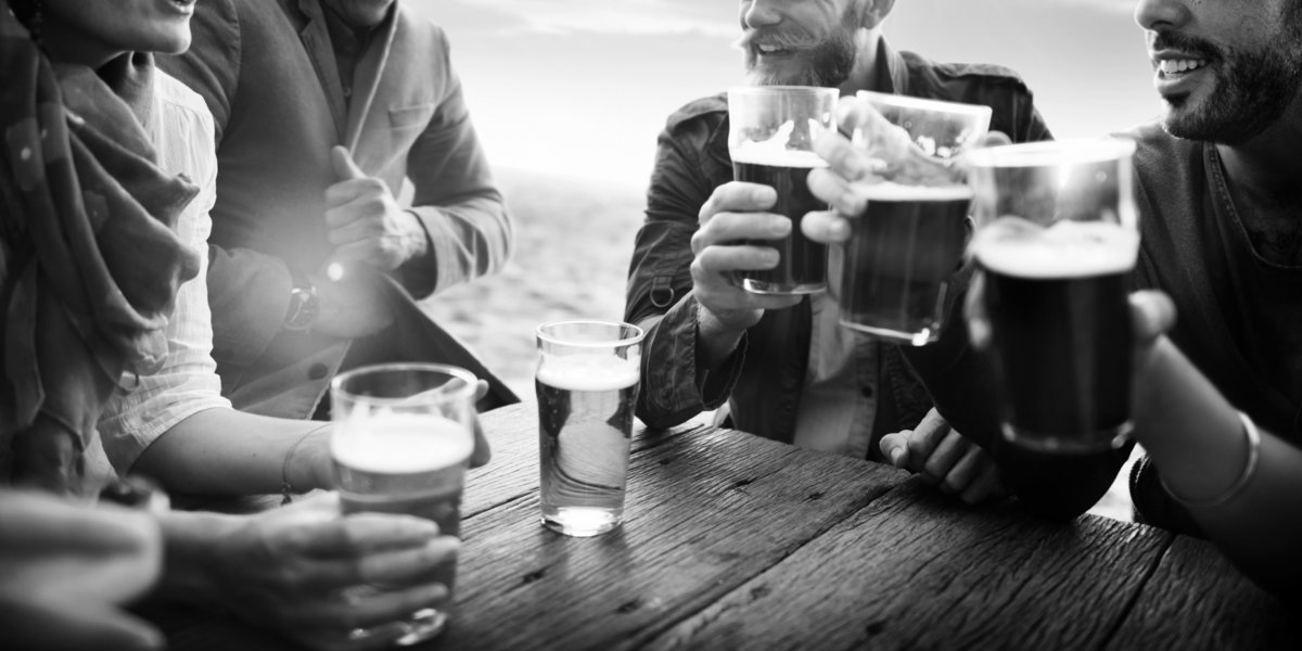 friend group with pint glasses BW