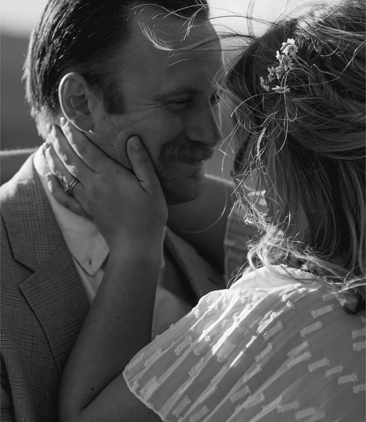 sweet and cute moment of bride holding the groom's face in her hands as she goes in for a kiss during their elopement in Bend, OR