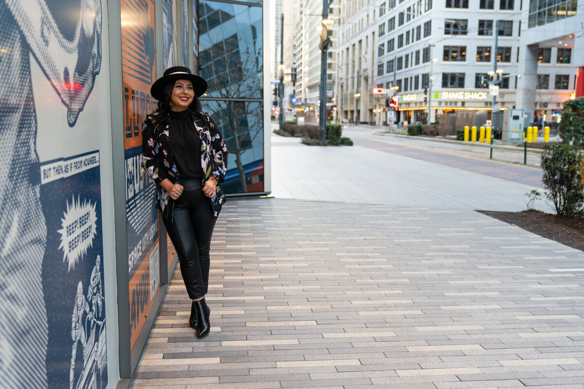 Realtor poses in Downtown Houston on Main street for branding photographs