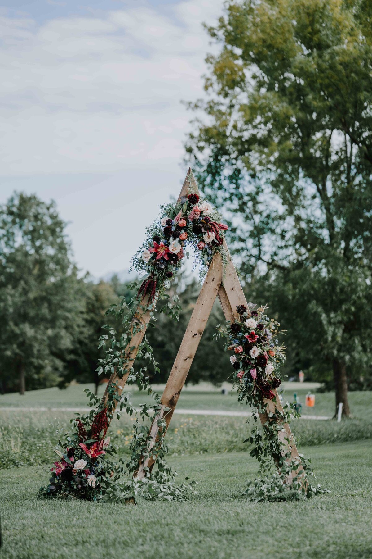 a double triangle shaped altar for a wedding ceremony