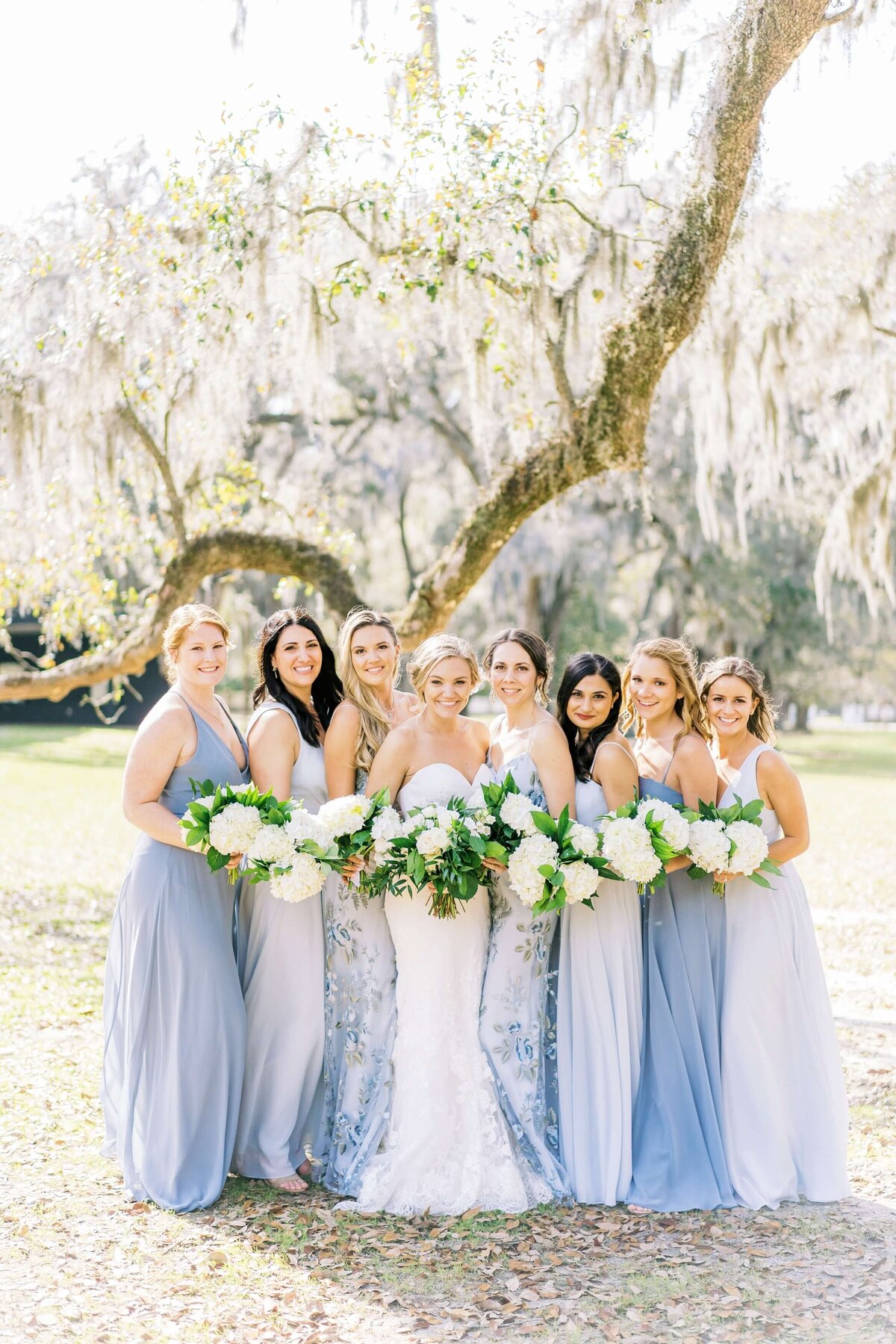 bride with bridesmaids in french blue dresses
