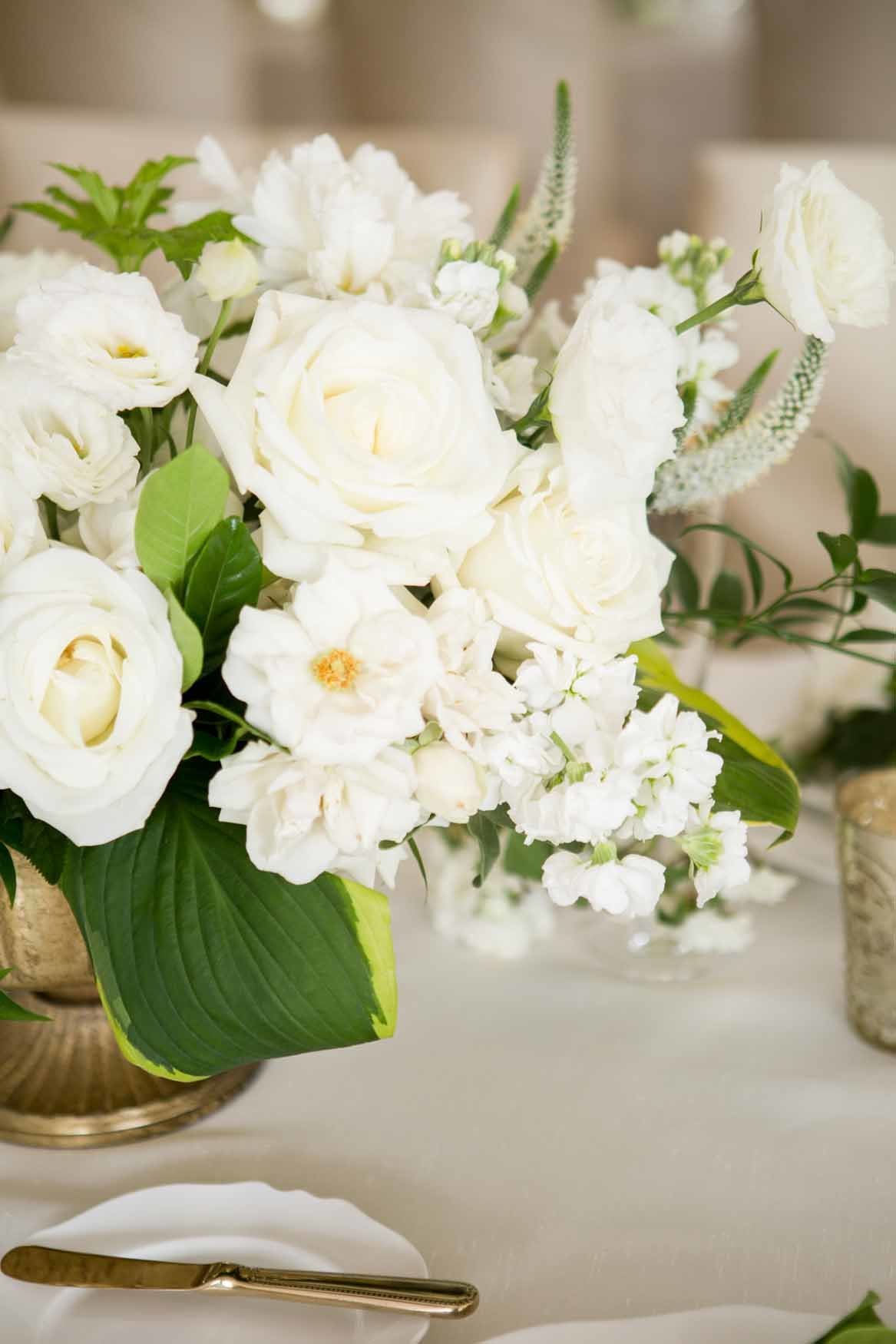 Low compote floral design with garden roses, veronica and hosta