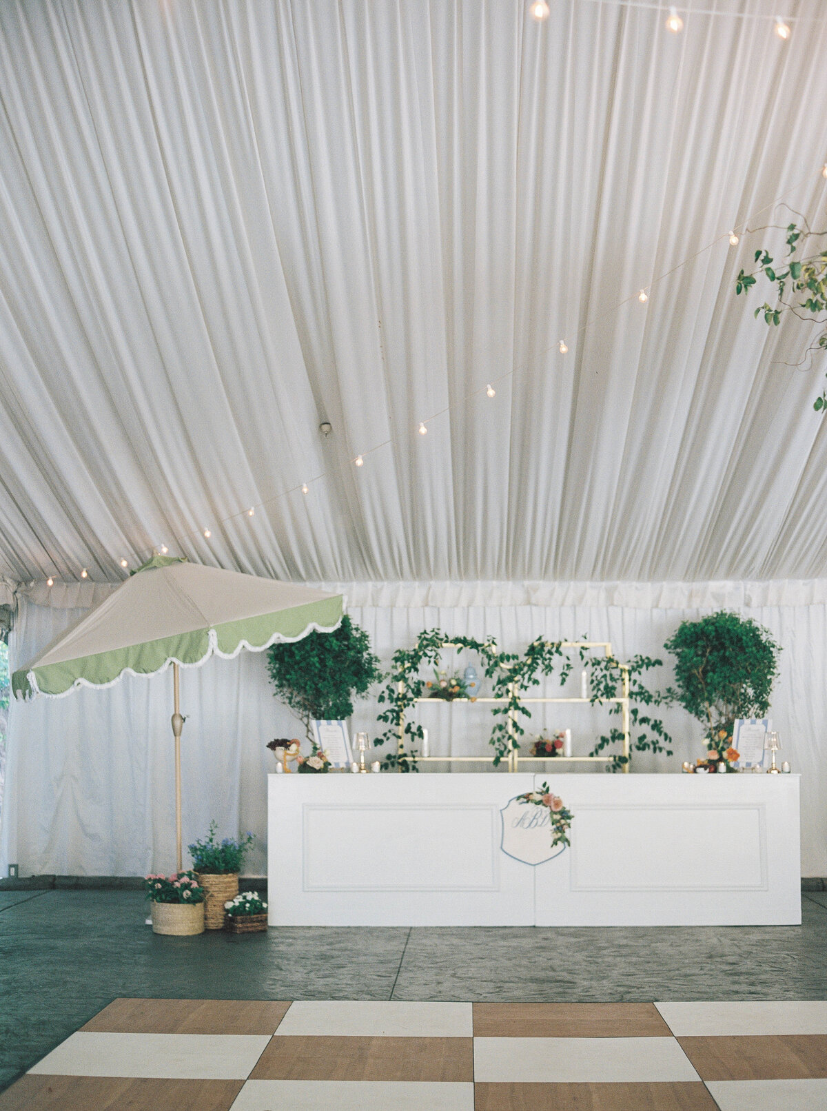 Luxury wedding photography showcasing a beautifully styled wedding reception drink station with fine art floral details and signature cocktails.