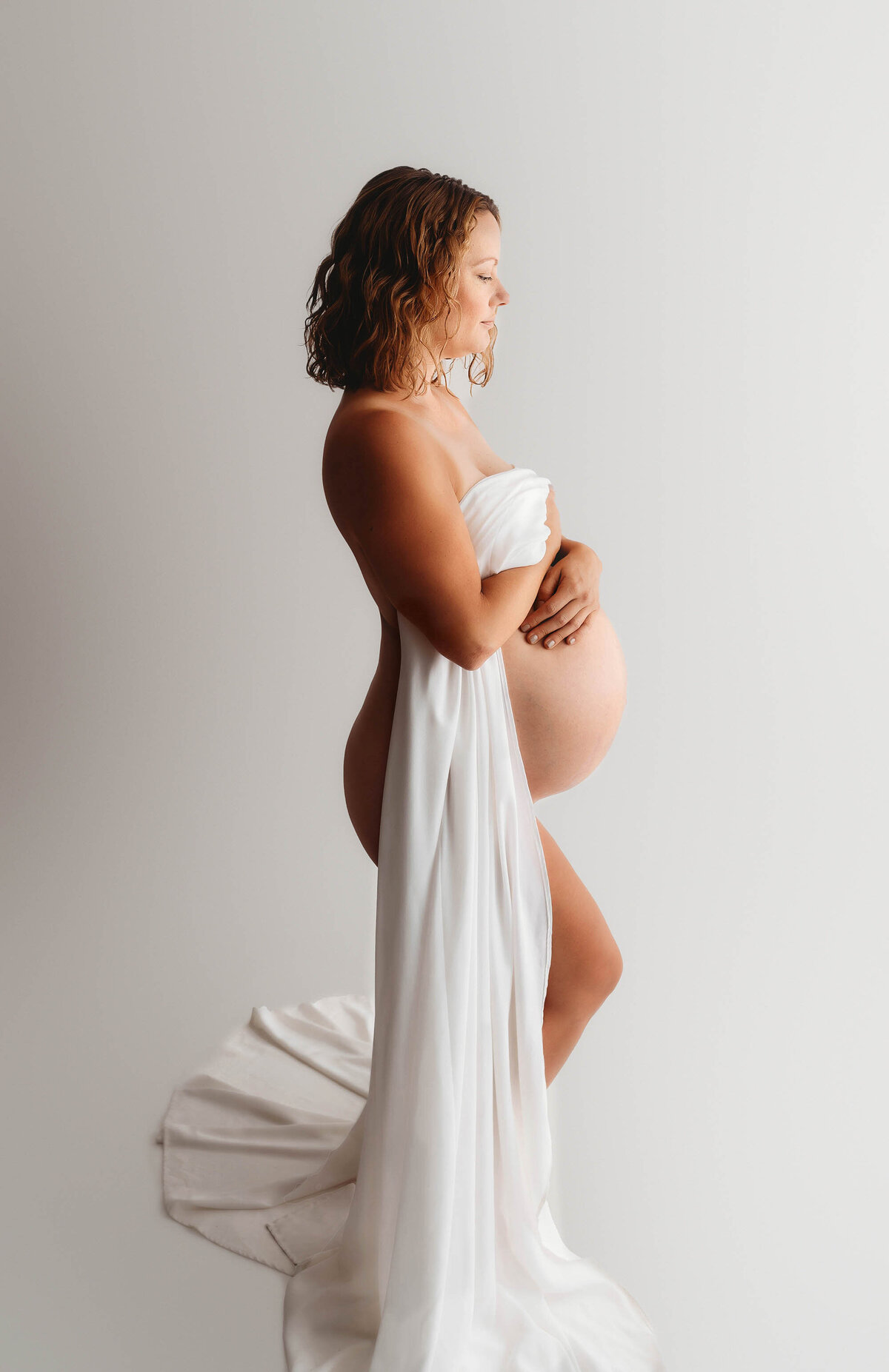 Pregnant woman poses for Editorial, Studio Maternity Photos in Charleston, SC.