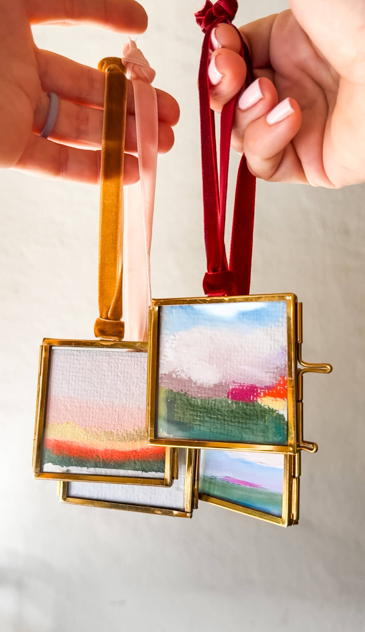 kristin vanderlip 2025 art ornament collection holding ribbon