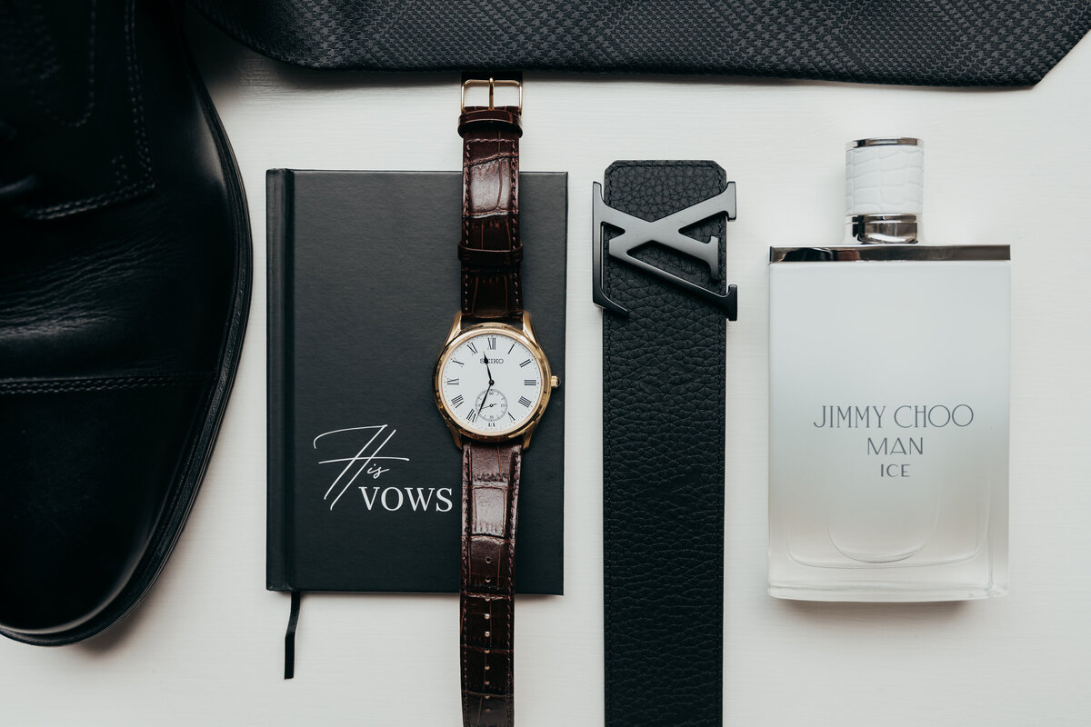 i love capturing the grooms details also. Jimmy Choo cologne, Louis Vuitton belt, the grooms watch with his vow book. Perfect little details.