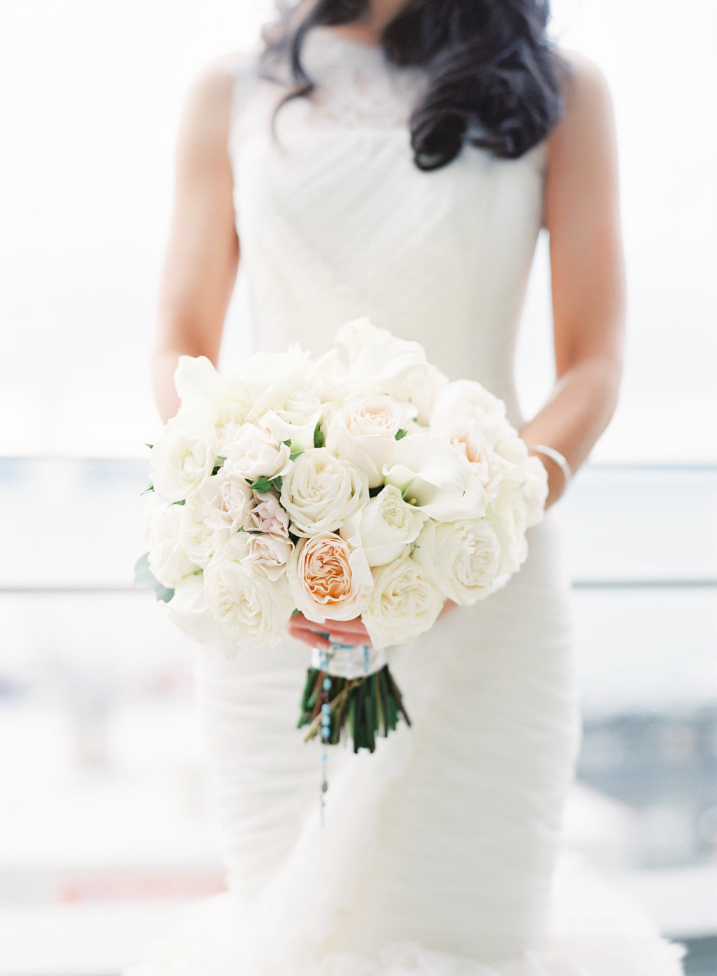 Classic pave rounded rose bridal bouquet in whites and blush.