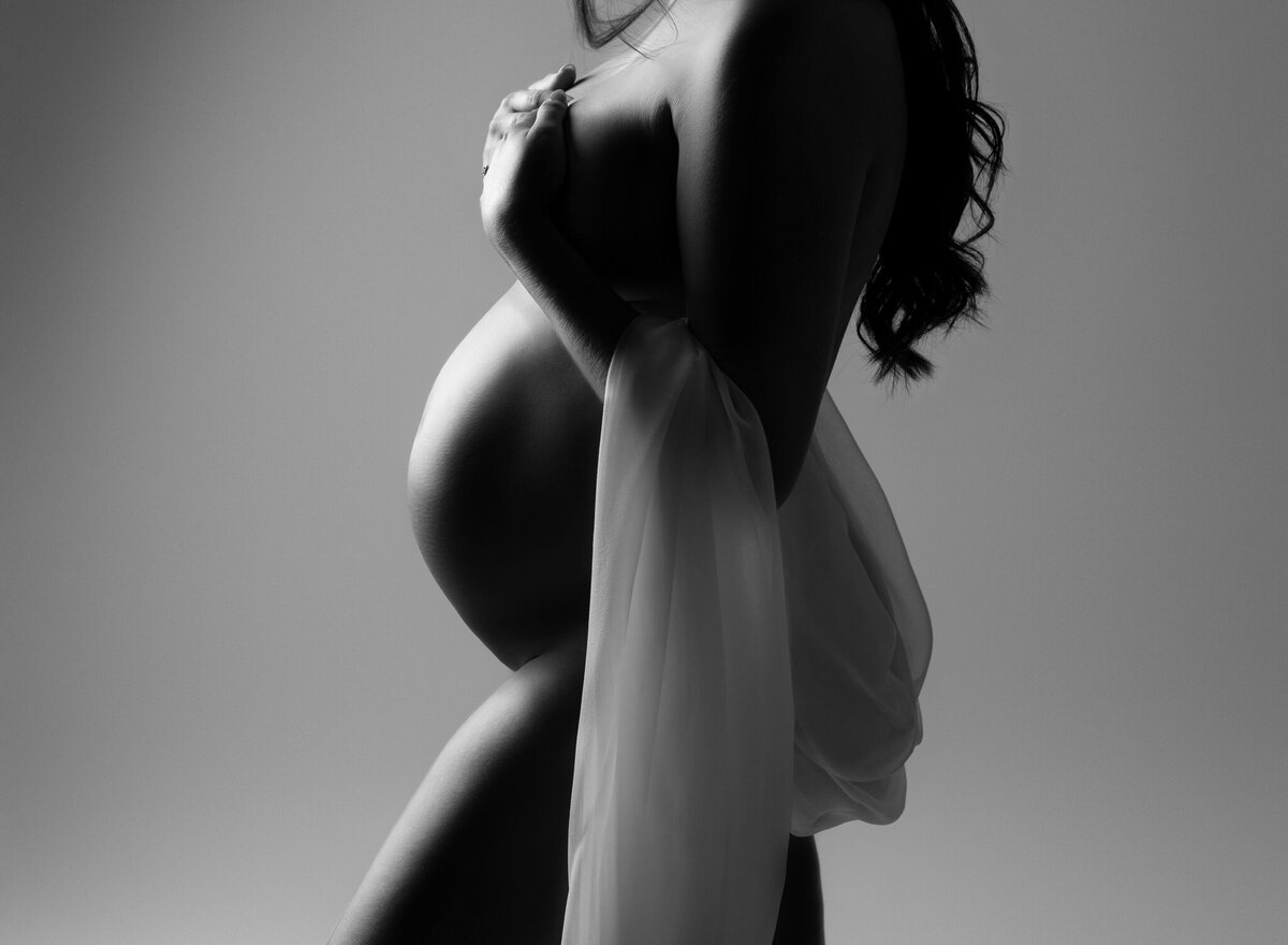 nude pregnant woman long dark hair
