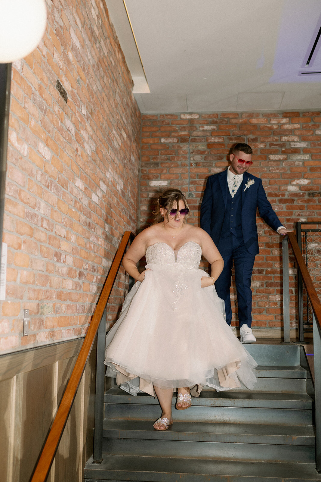 Bride and groom enter their reception at the Rally Hotel in Denver Colorado.
