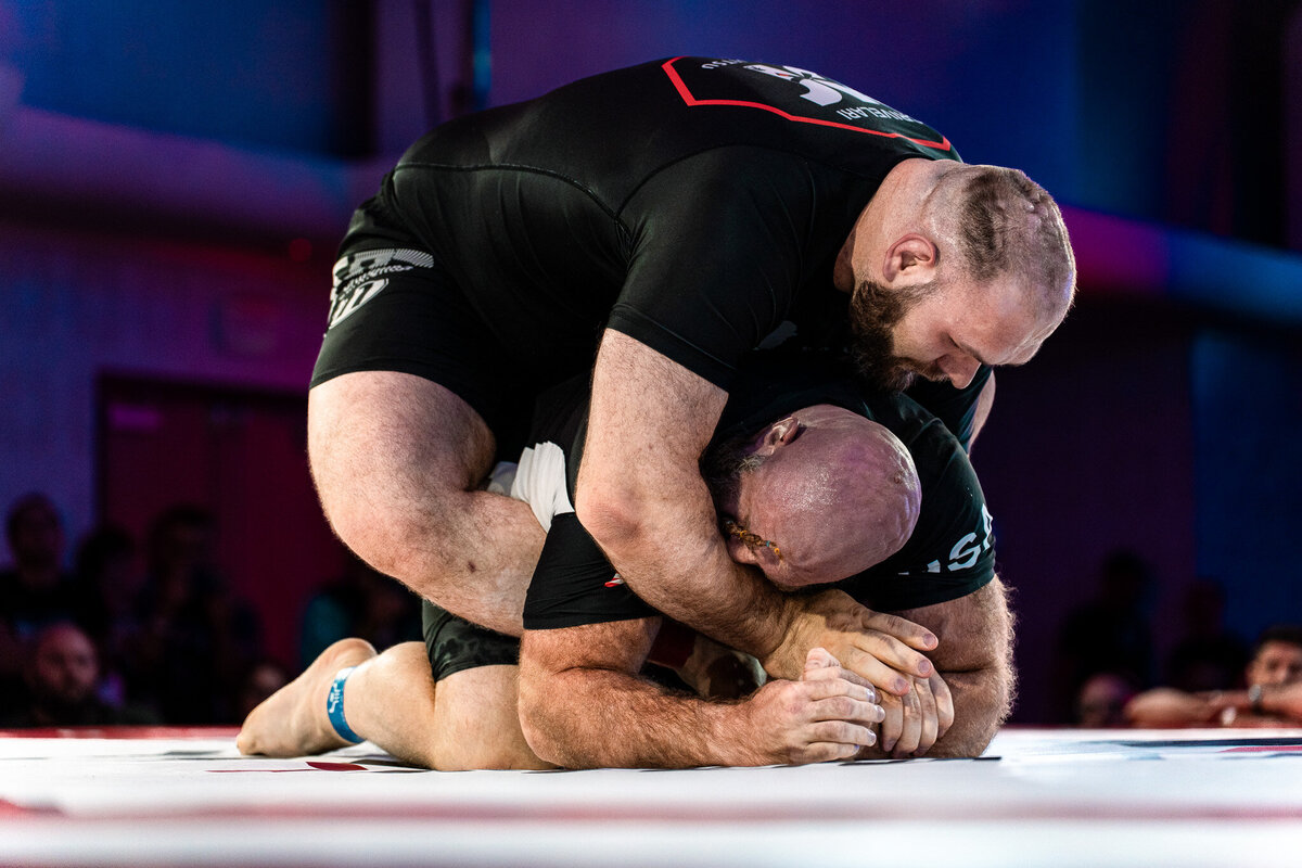 Two athletes grappling at F2w