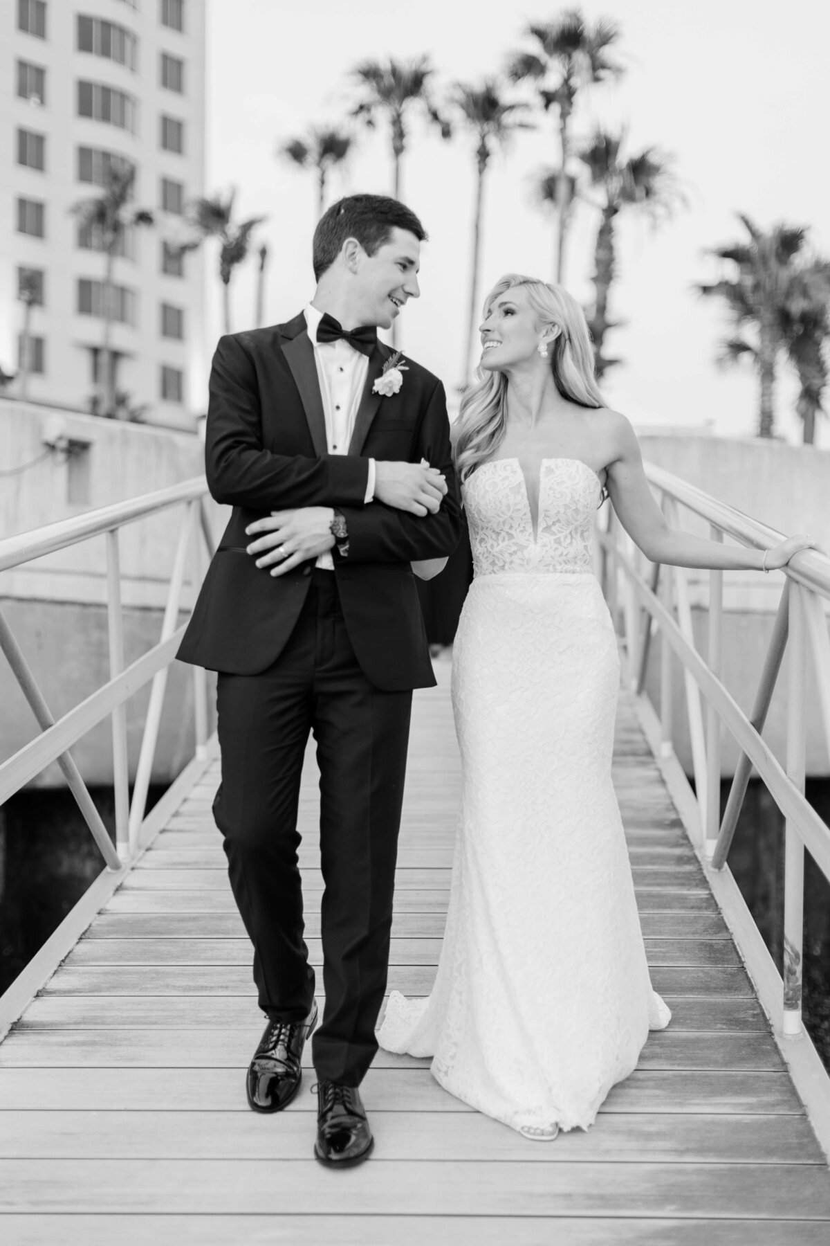 A bride and groom hold eachother on the docks of the Westin Savannah.