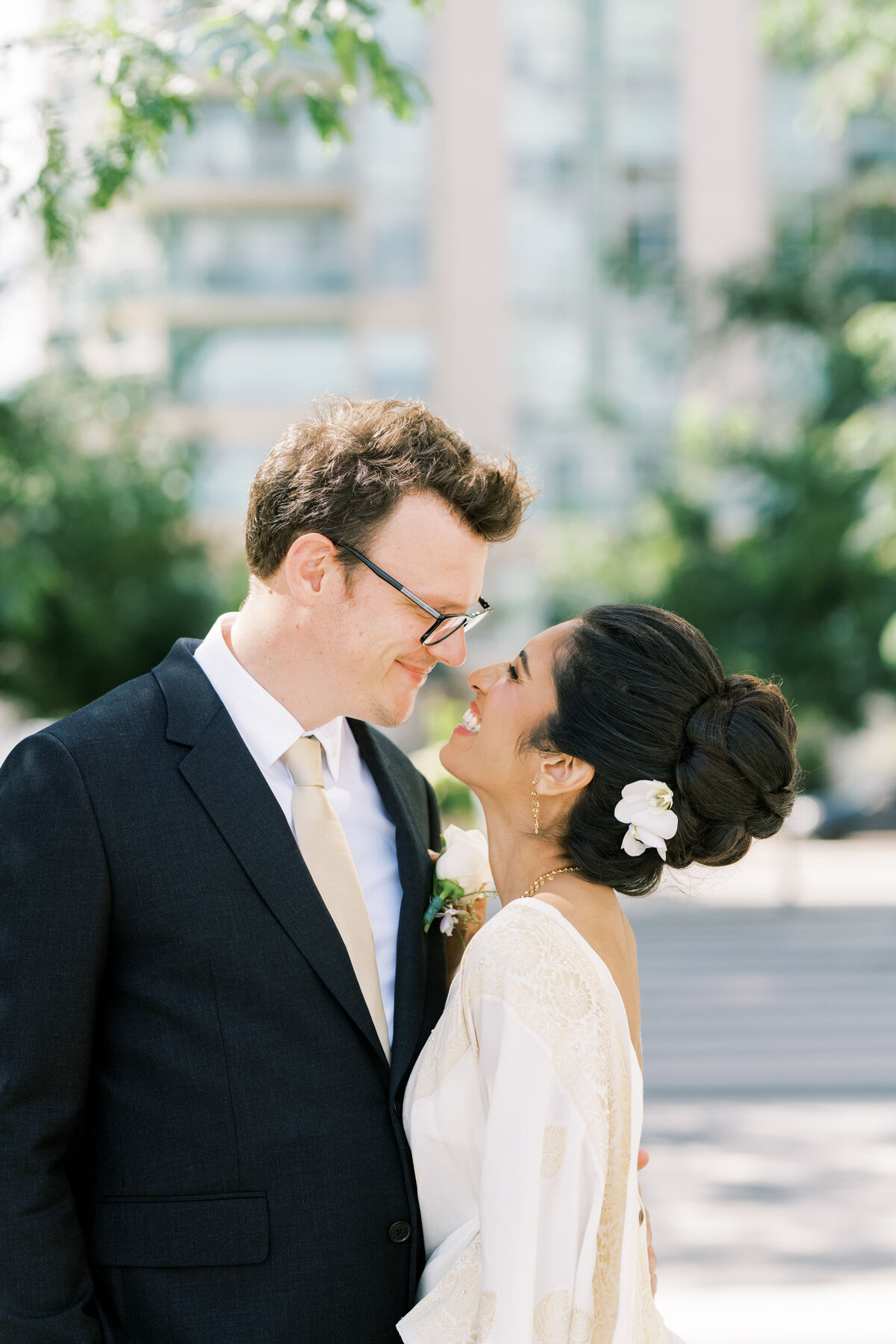 bride and groom sharing a moment together outside in the courtyard at the pearle hotel