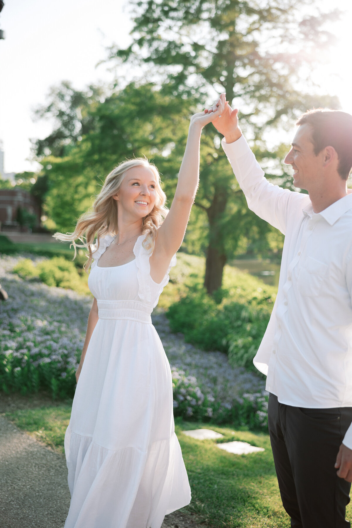 Sunlit spin during Columbus engagement photo session by Philadelphia-based wedding photographer.
