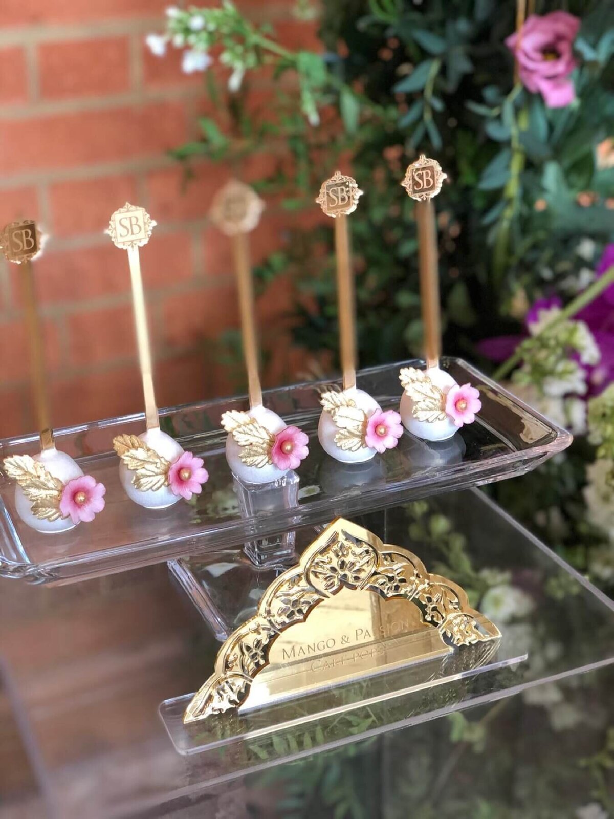 Luxury cake pops displayed on a glass cake stand