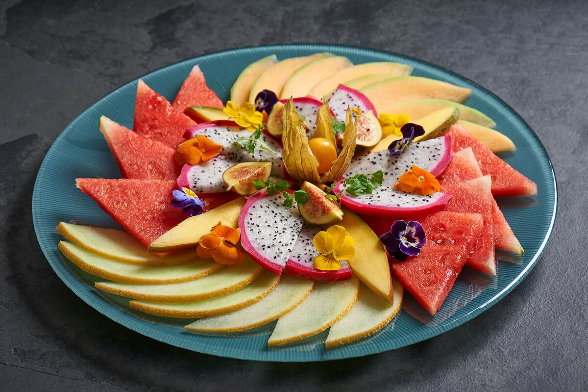 A large plate with melon slices