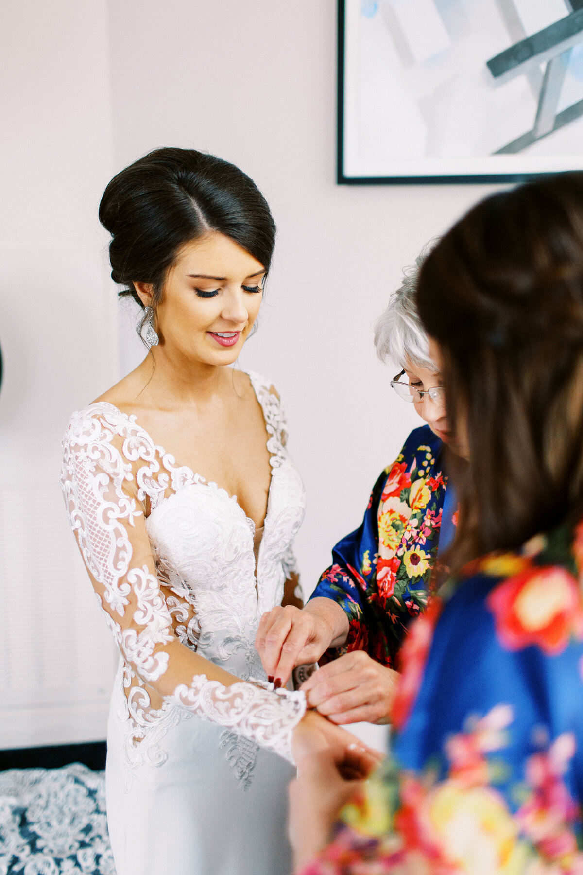 Bride putting on her bracelet