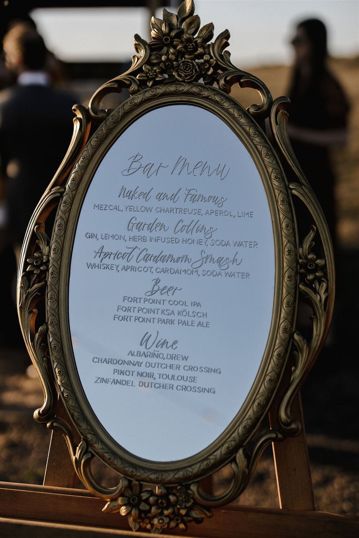 Oval mirror with floral details, available to rent in the Bay Area for weddings