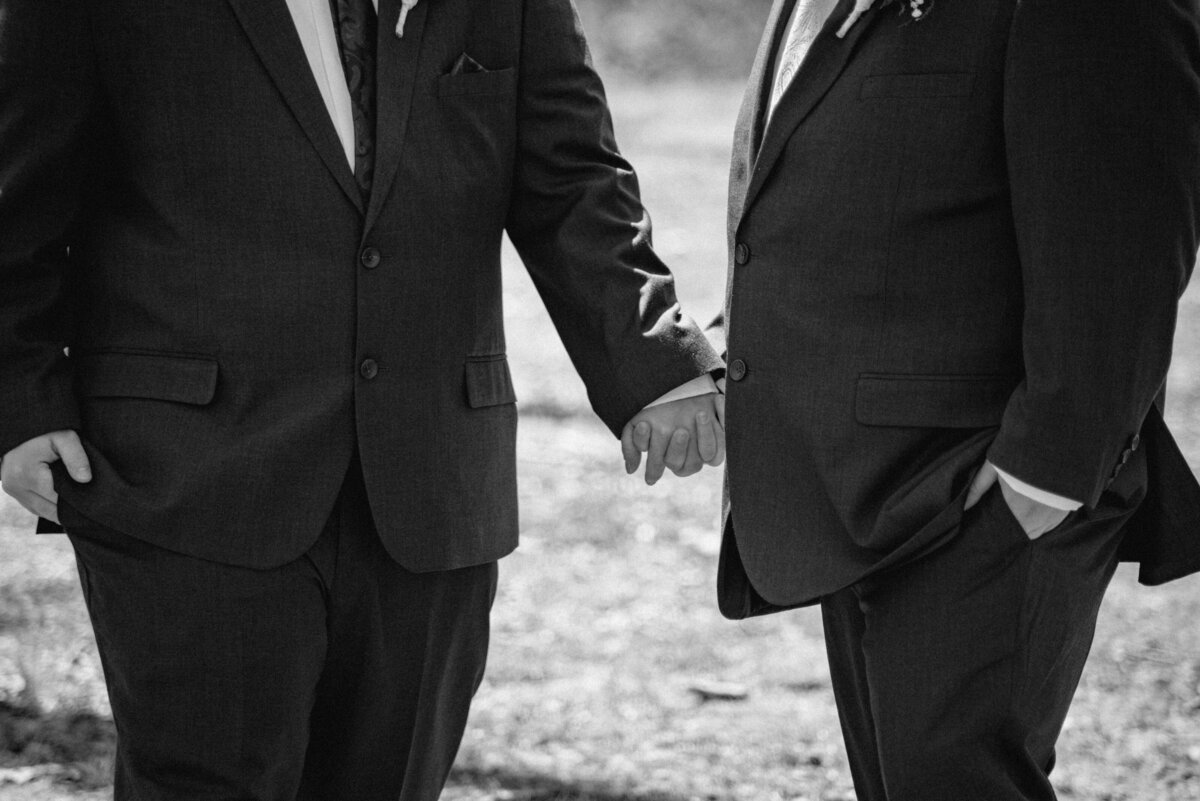 A couple holding hands before their wedding ceremony in Rochester