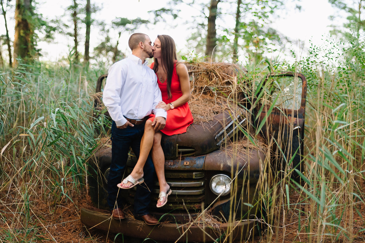 eastern shore md couple kissing on old abandoned truck