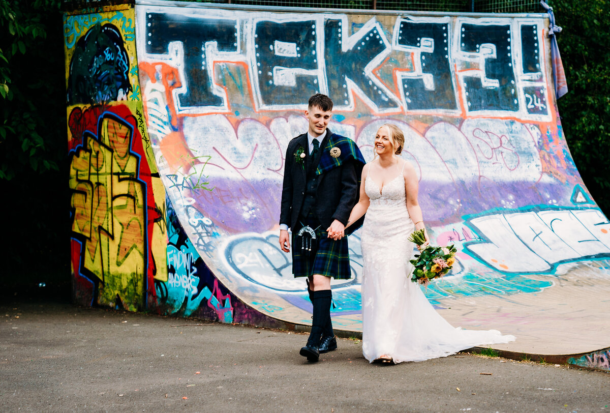 Bride and groom in skatepark in Glasgow