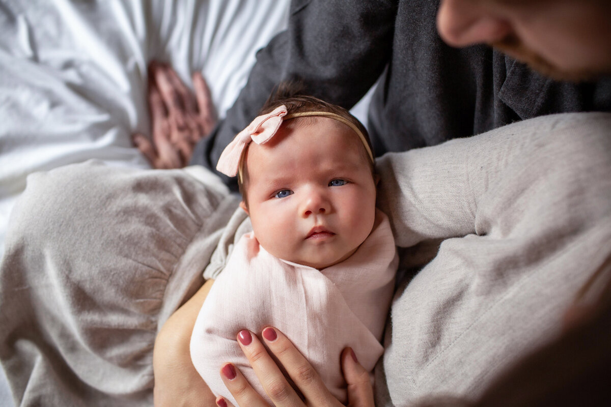 Beautiful baby portrait  from Mom's arms.