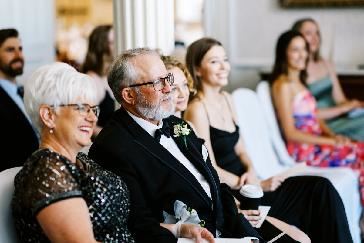 parents of bride and groom smiling at the ceremony