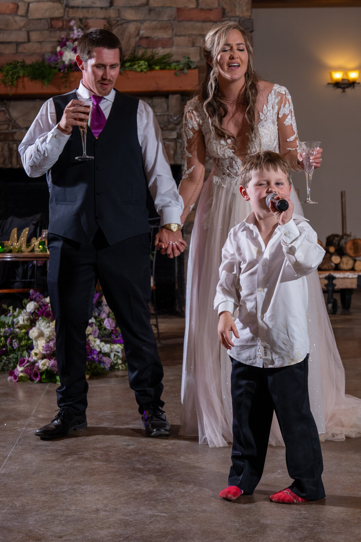 a young child singing at a wedding reception 