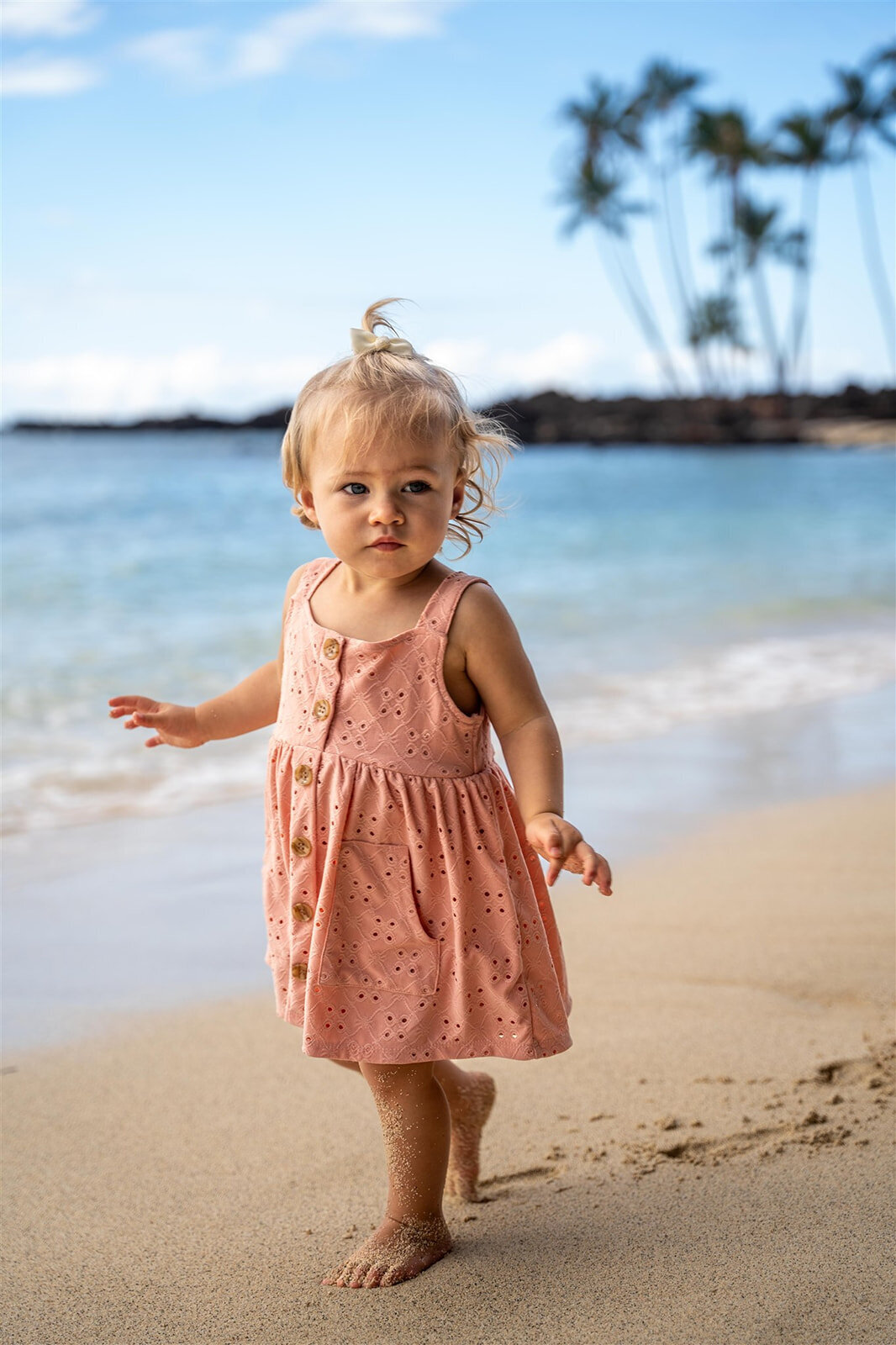 Little girl on the beach for hawaiian family photoshoot