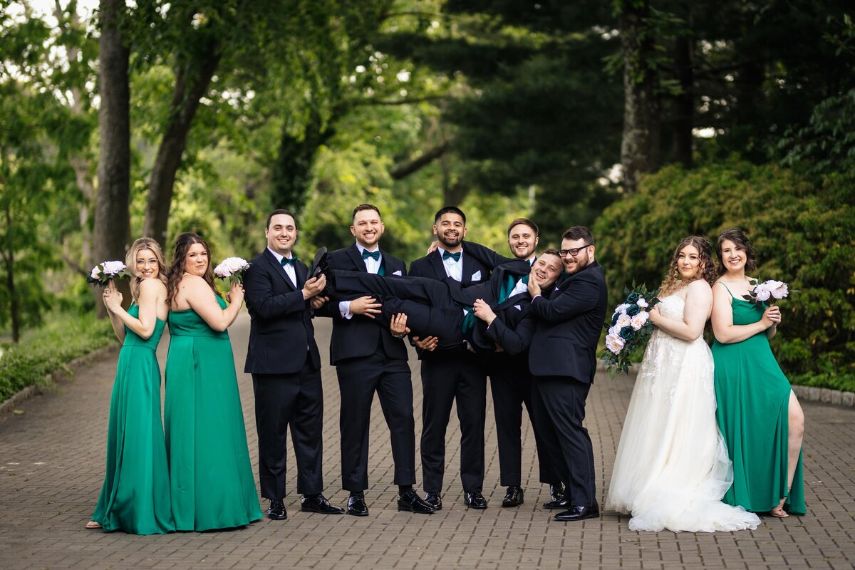 reen Bridemaid Dresses & Black Groom & Groomsmen Suit