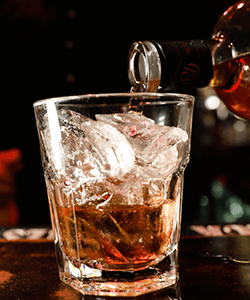 Pouring a Whiskey at the Martini Lounge at Max Dales Steak and Chop House