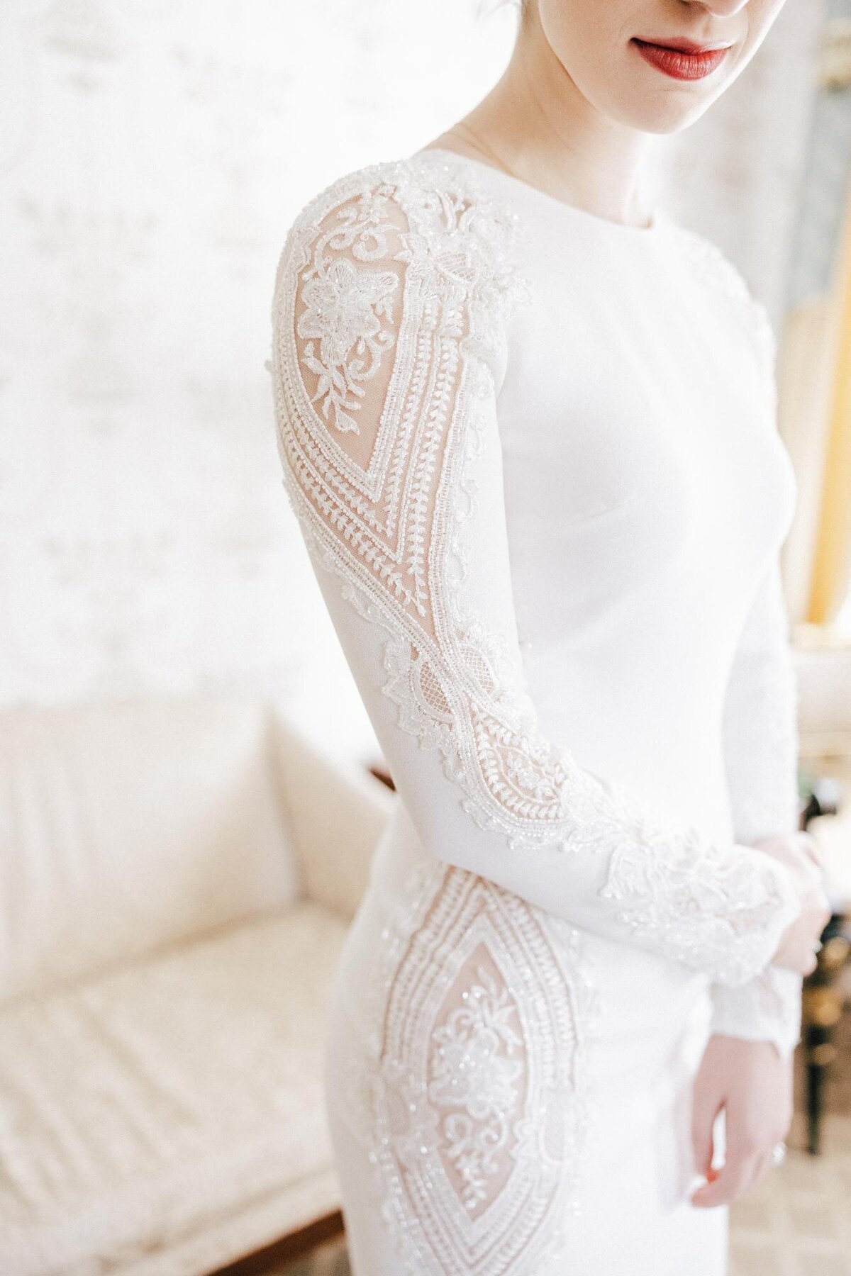 Elegant bridal dress with detailed lace patterns.