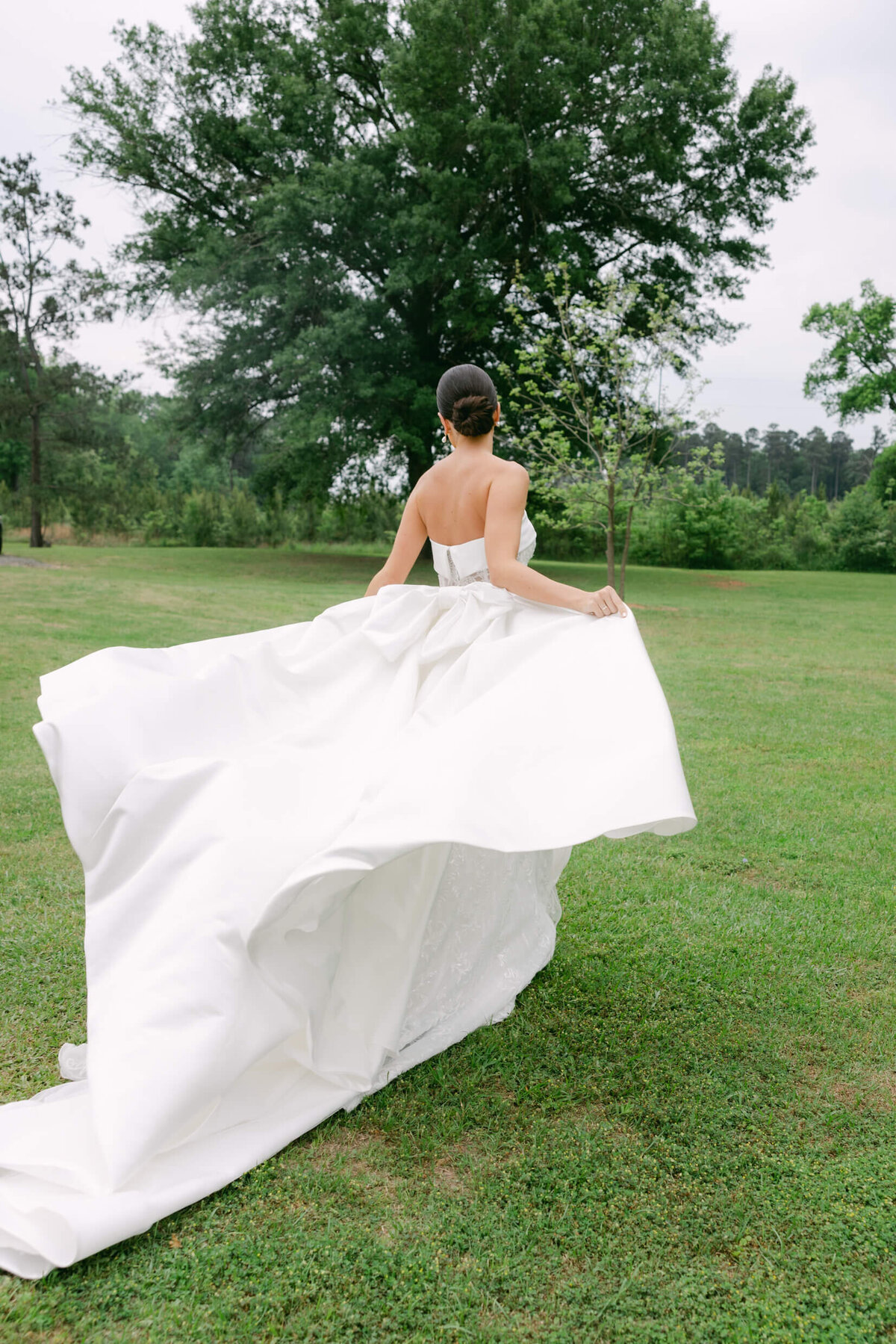 A wedding day portrait photo of the bride in her white wedding dress