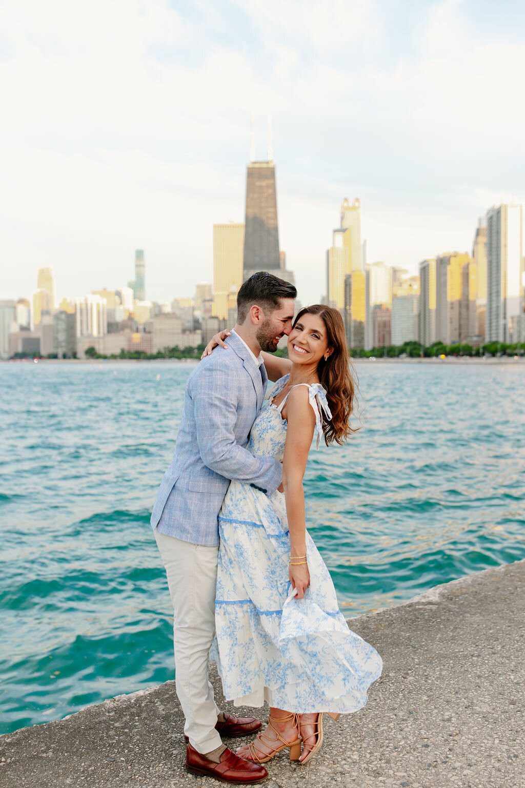 An engagement photography session at The Wrigley Building and North Ave Beach in Chicago, Illinois - 28