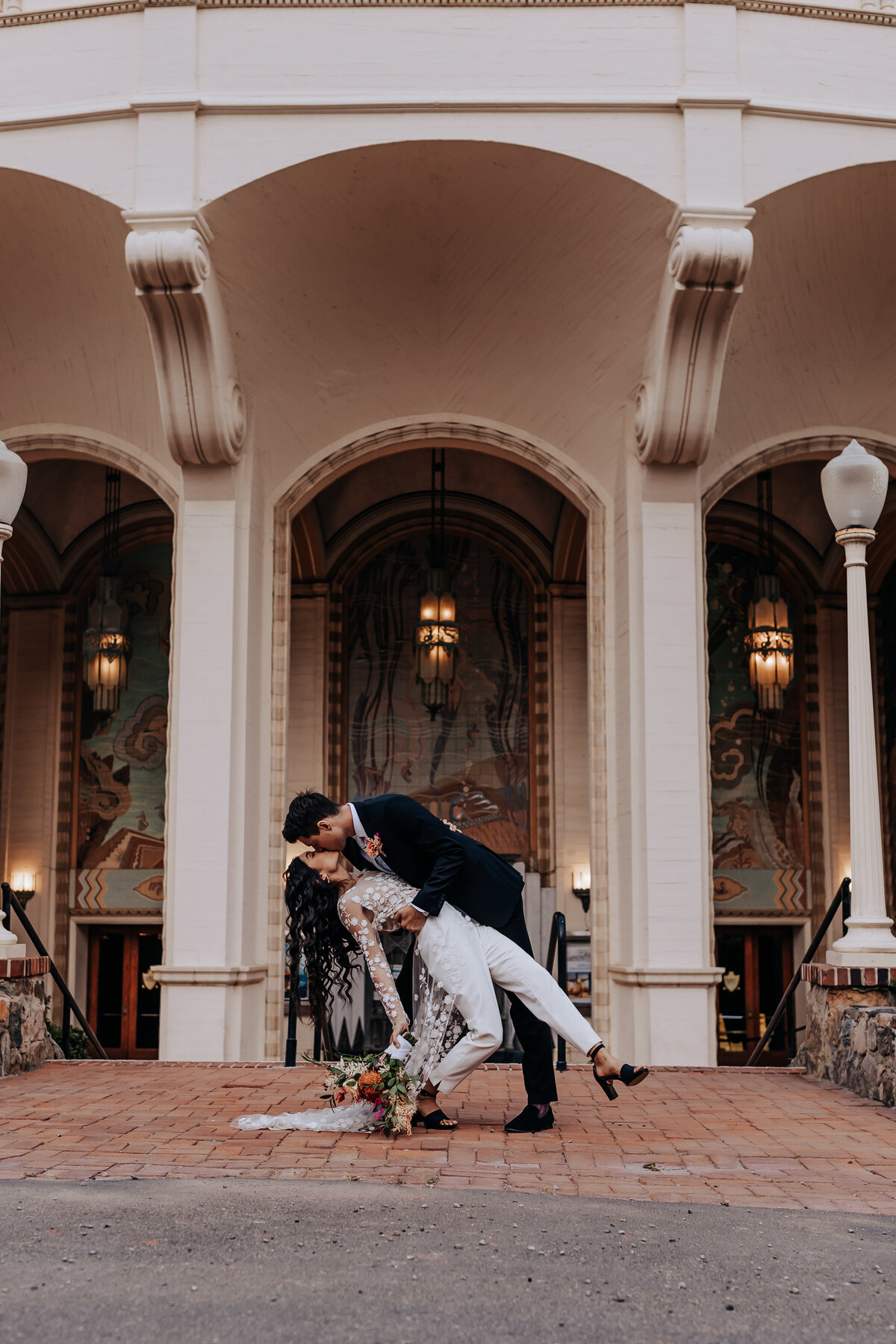 Destination elopement photographer captures couple dip kissing