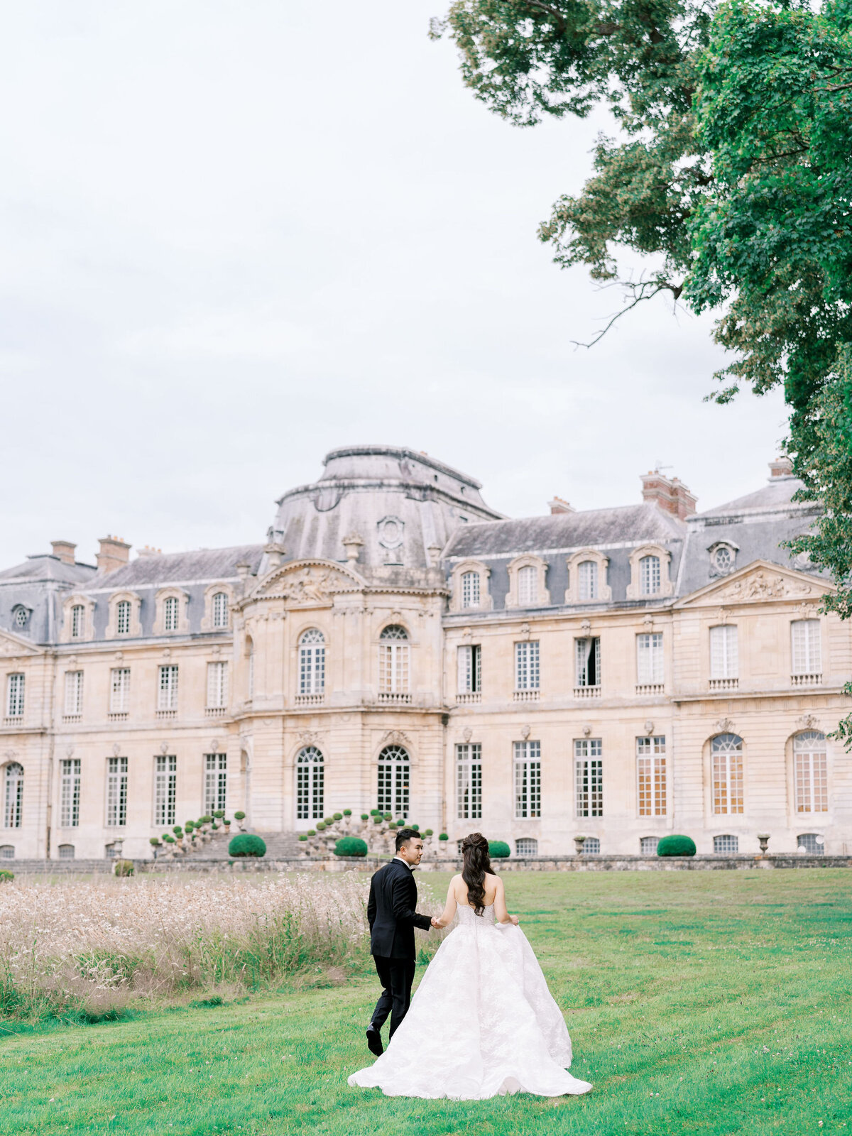 Bride and groom at Château de Champlâtreux wedding in France
