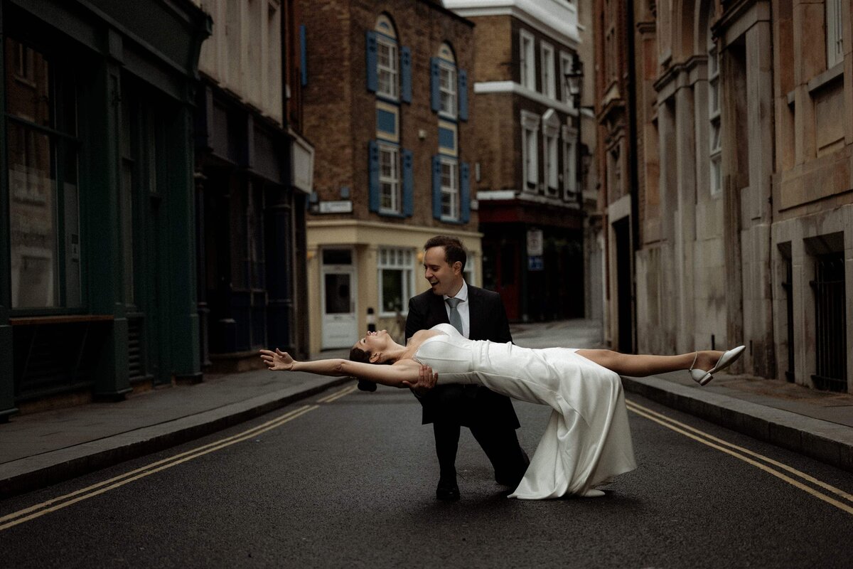 Cinematic wedding and elopement photography in London, a romantic couple dancing near St Paul's Cathedral