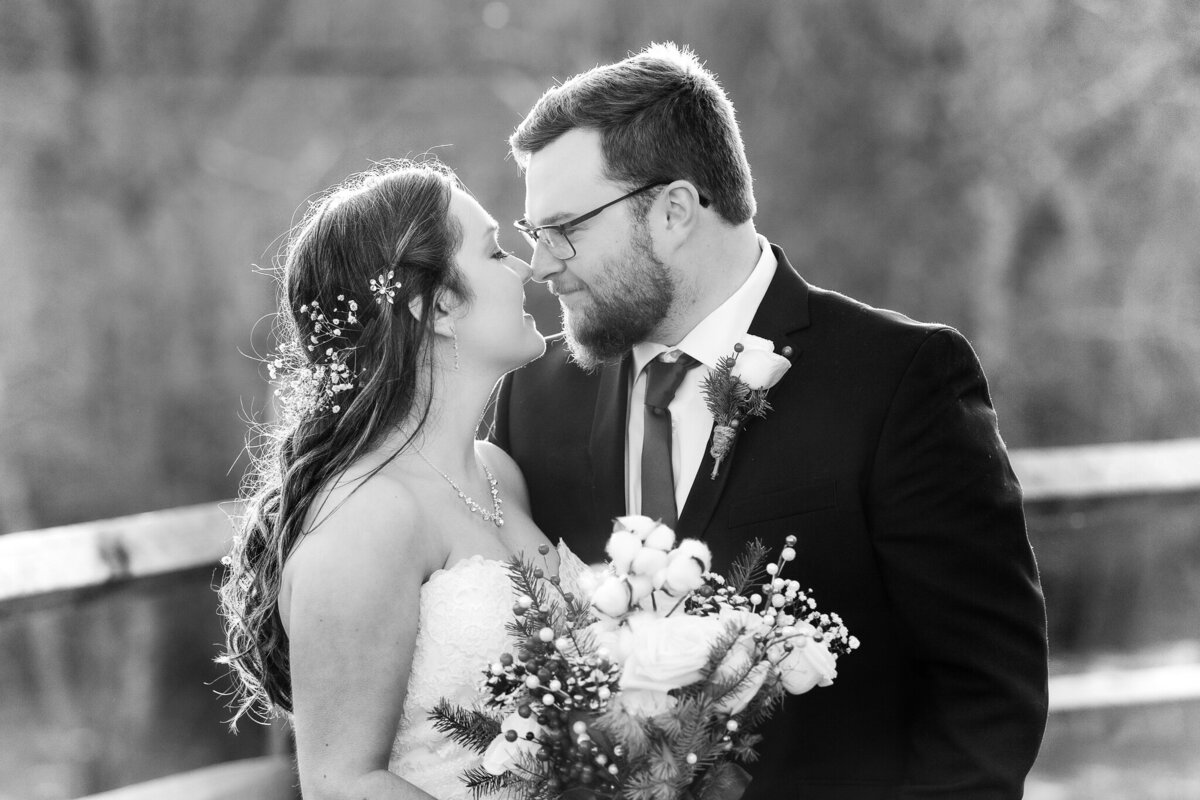 Bride and groom kissing at the Barn at Sandcastle Farms