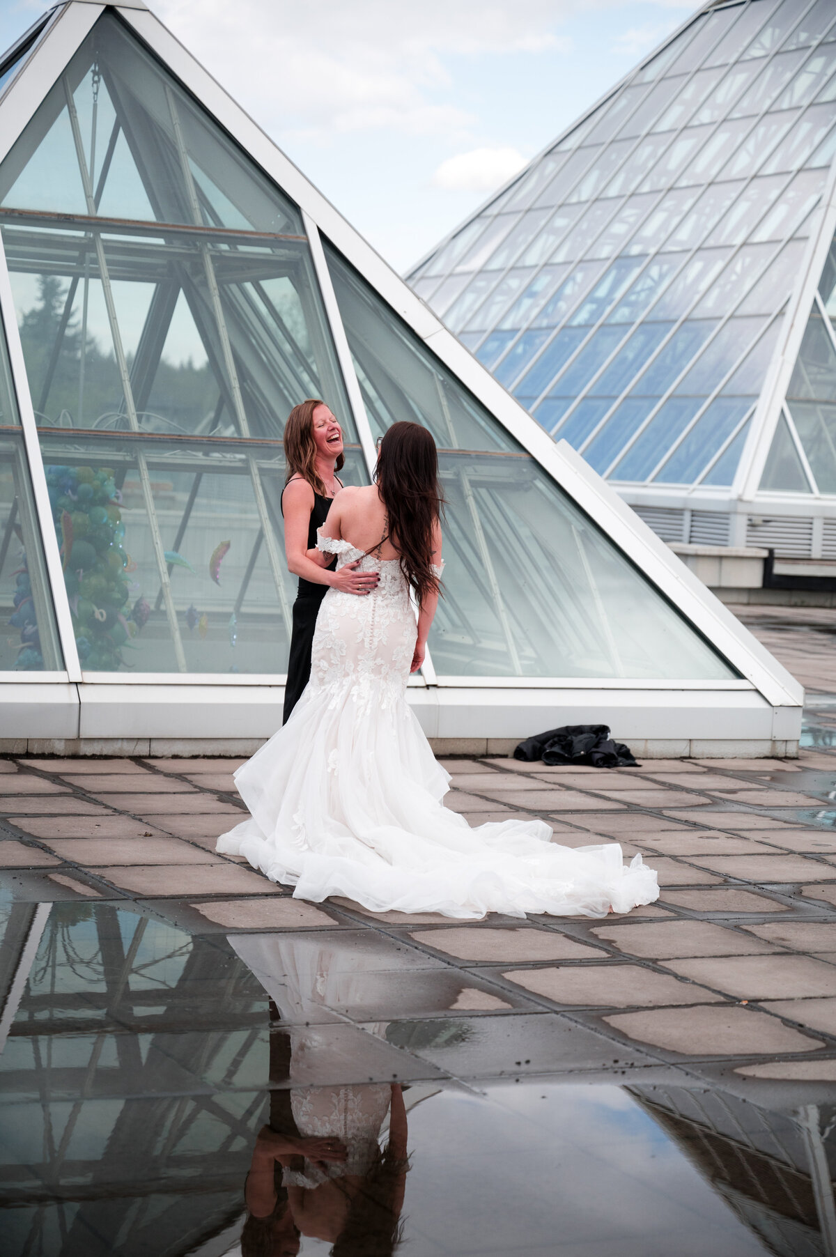 bride holding flower girl