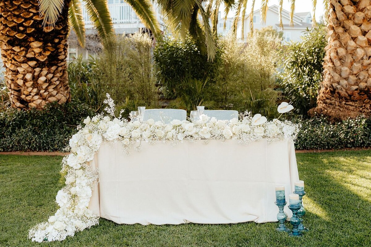 white-floral-runner-blue-candles
