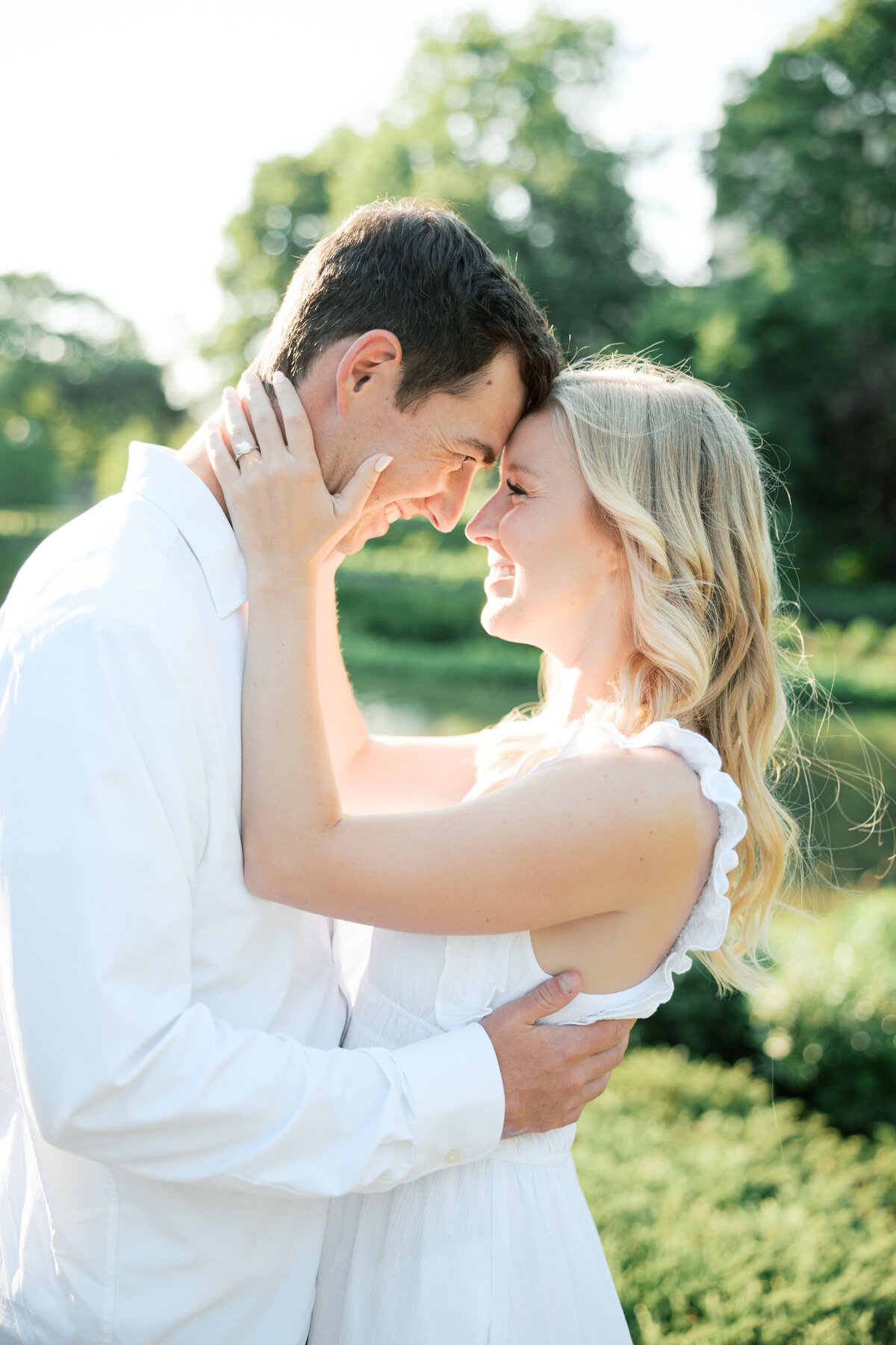 Sweet forehead touch during Columbus engagement shoot, photographed by Philly wedding pro.