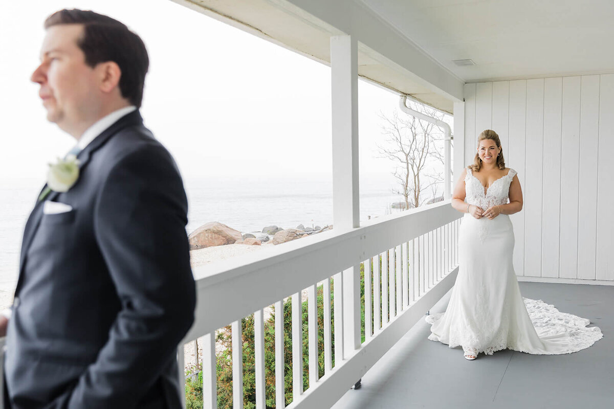 Bride and groom first look on a balcony at Long Island wedding