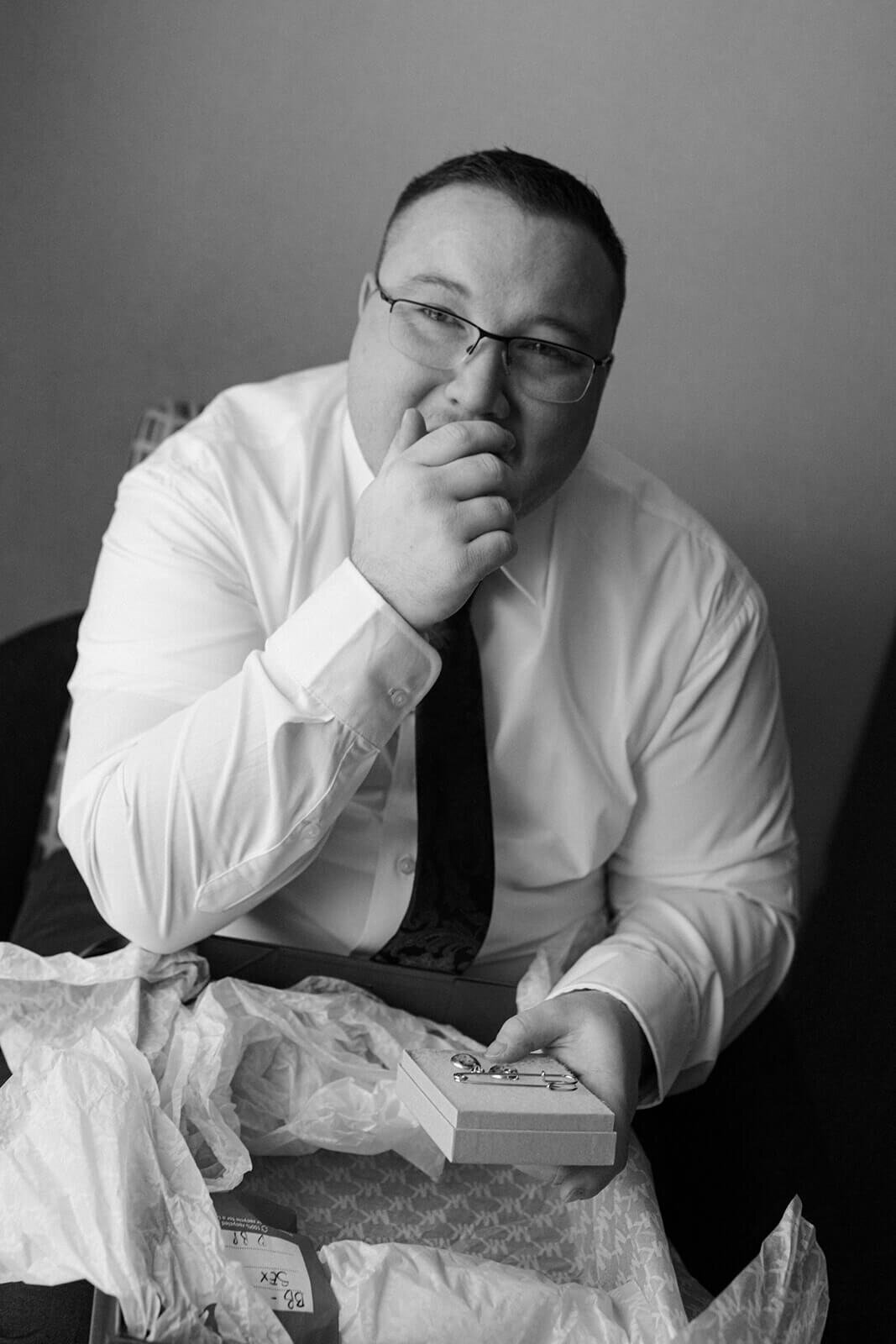 Man looking emotional holding a book