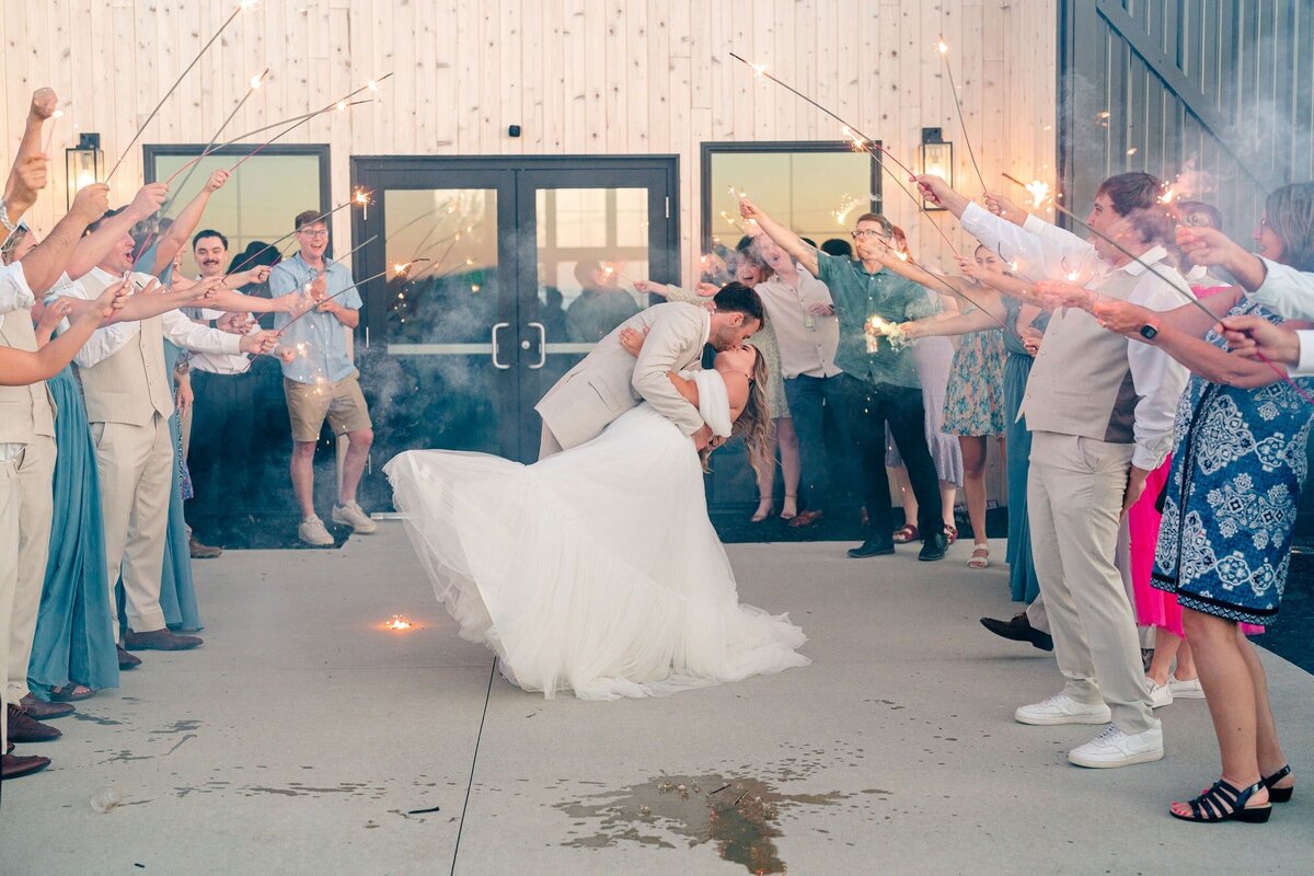 groom-dipping-bride-grand-exit