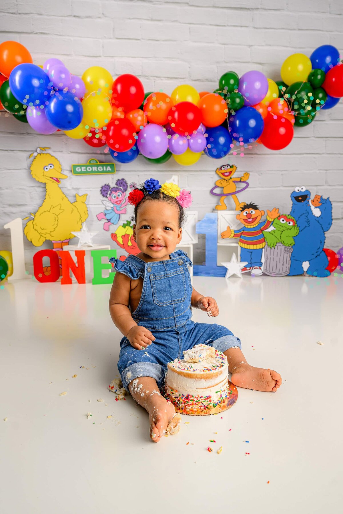charlotte girl smiles and laughs as she smashed her birthday cake