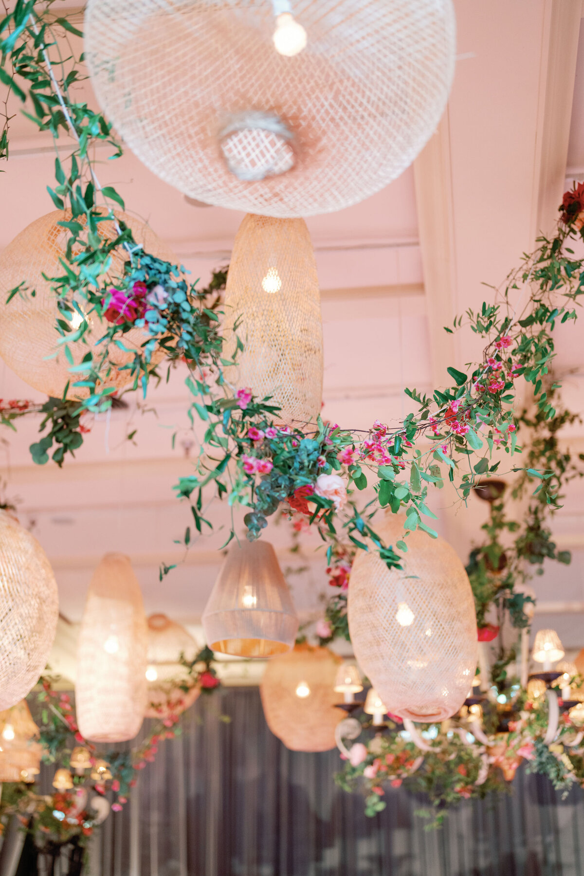 Floral decorations hanging from inside the tent at the reception.